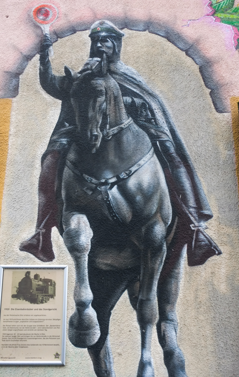 mural of a man on a horse, equestrian statue