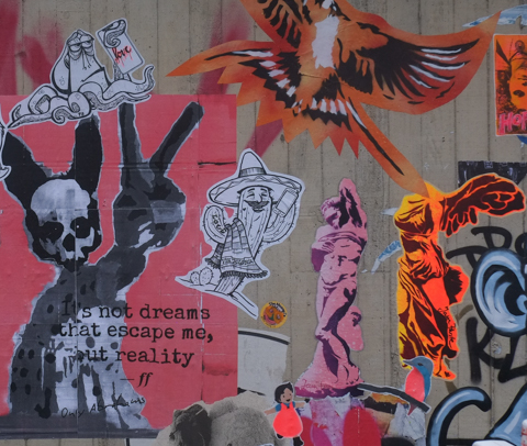paste ups on a concrete wall
