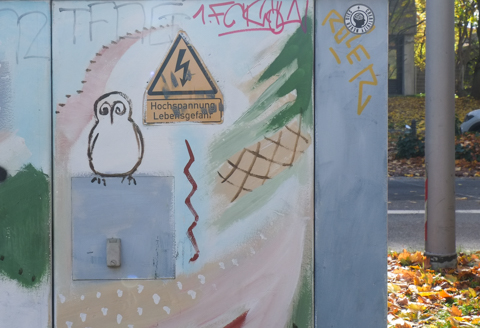 drawings and paintings on a sidewalk electrical box, a little owl