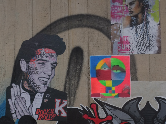 paper paste up graffiti in Bonn including an image of Elvis Presley. Rock and Roll King,