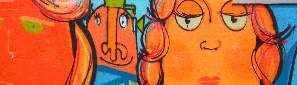 part of a large mural on kiefernstraase, orange faces