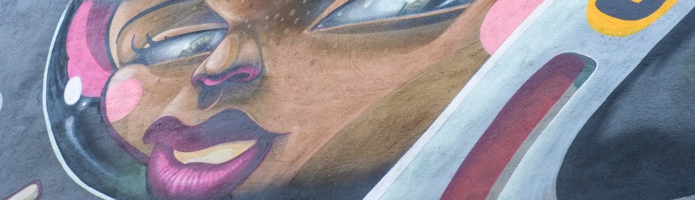 part of face of astronaut in mural by Danjer Mola in Nippes Cologne, woman in astronaut outfit