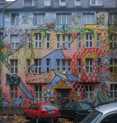 residential building on kiefernstrasse covered with street art