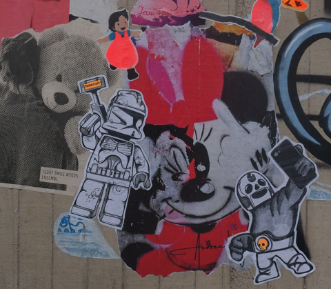 paste up graffiti in Bonn including a lego figure robot