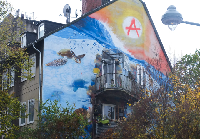 gable mural by Ami One in Dusseldorf, marine scene including turtles swimming in the water