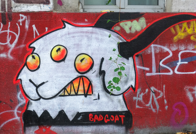 bad goat graffiti, a white goat head with black horns and three eyes, graffiti