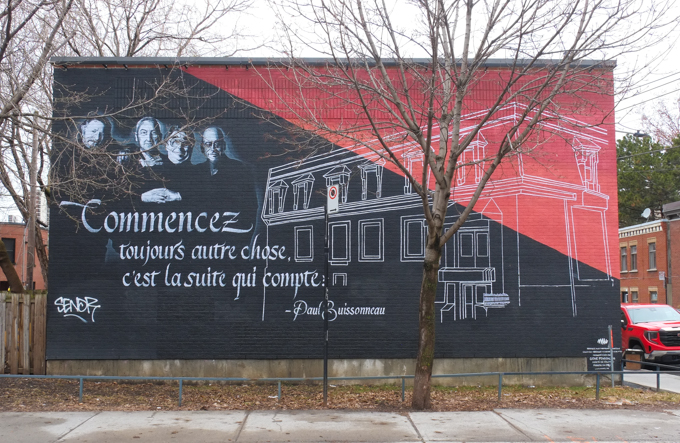 mural by sender in red and black , white line drawing of a building, with a quote in French from actor Paul Buissonneau, Commencez toujours autre chose c'est la suite qui compte which translates to Always start something new; it's what comes next that counts.