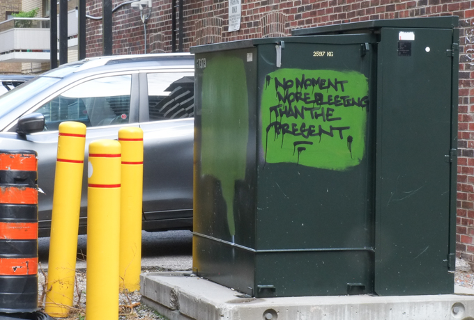 graffiti that is all text, words that say No moments more fleeting than the present