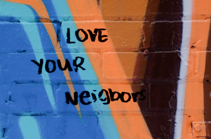 graffiti that is all text, words that say love your neighbor