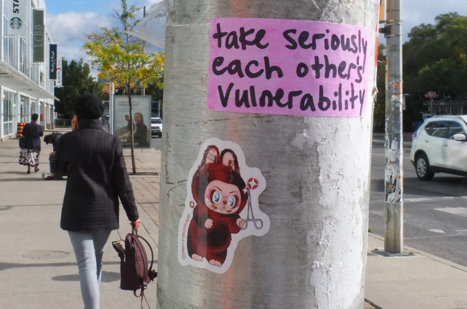 graffiti that is all text, words that say Take seriously each other's vulnerability