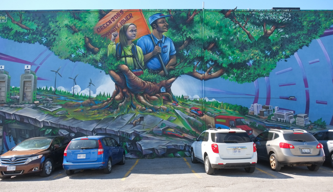 mural by Bruno Smoky, green future energy, electric vehicles, windmills