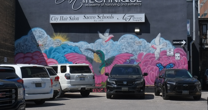 mural with hummingbird, flowers, butterflies