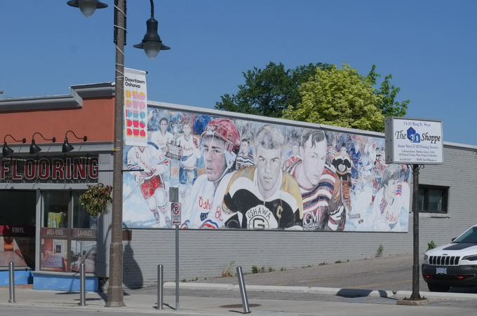 mural by Paul Ygartua showing famous hockey players that once played for the Oshawa Generals junior team, including Bobby Orr, Eric Lindros,