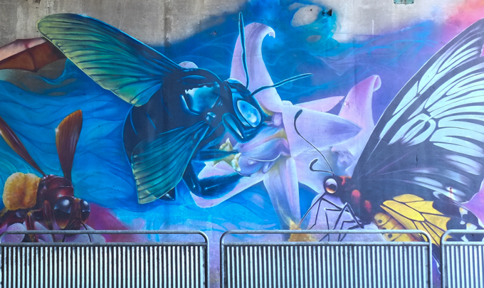 part of an animal themed mural by Nick Sweetman in Toronto, bee and butterfly