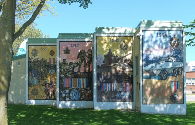These four panels depict some of the history of the Ontario Regiment starting with its formation in 1866. The other panels memorialize various battles and conflicts that they have been involved in since then. These panels also stand in Memorial Park and were painted by John Hood