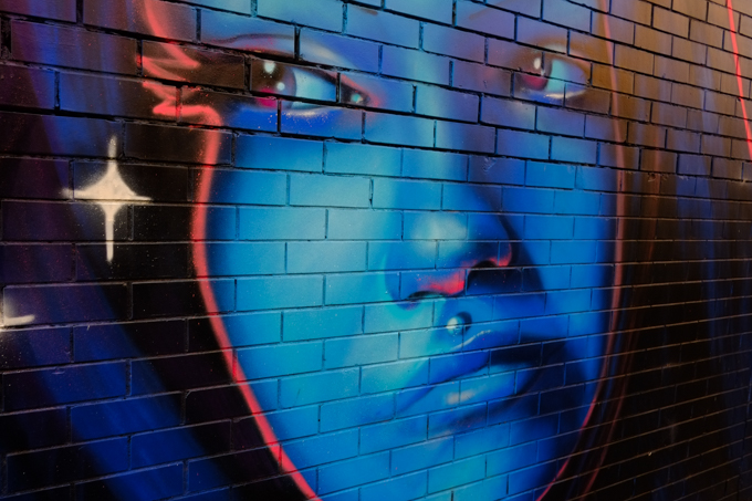 street art mural in Mirka Lane, St. Kilda, blue portrait of a woman by Juzpop