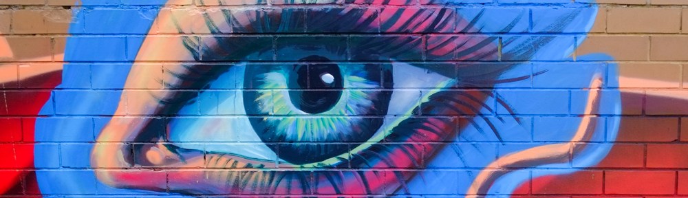 very large blue eye, part of a street art mural on Mirka Lane in St. Kilda, Melbourne