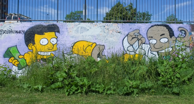 Simpsons themed mural, Homer Simpson is asleep, other man holding a fistful of money, weeds and grasses have grown up to cover bottom of wall