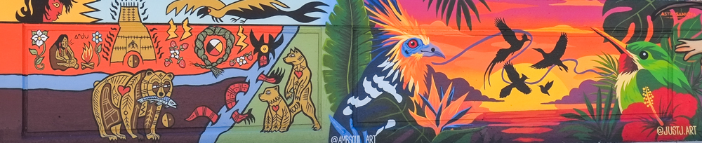 ambsoul and justj art murals on railway underpass, first nations style art, bear wit a fish in its mouth, a feathered bird, hummingbird, red flower,
