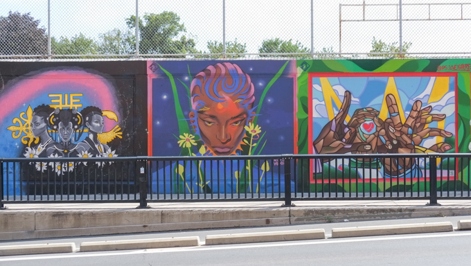 three street art murals on wall of railway underpass on Bloor street West.  Artists were Curtia Wright, Phillip Saunders, and Artistic Perception.  