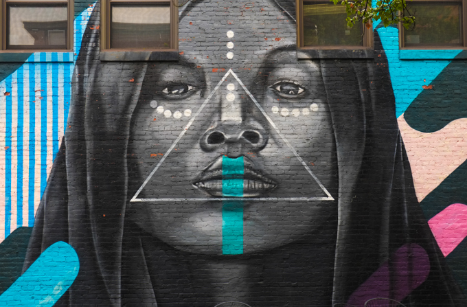 street art mural in Lynn Massachusetts, portrait of a black woman titled Black Madonna