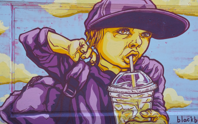 street art mural on wall of railway underpass on Bloor street West