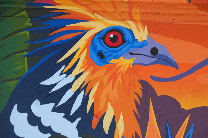 street art mural on wall of railway underpass on Bloor street West, bird head, part of a larger mural, by Ambsoul