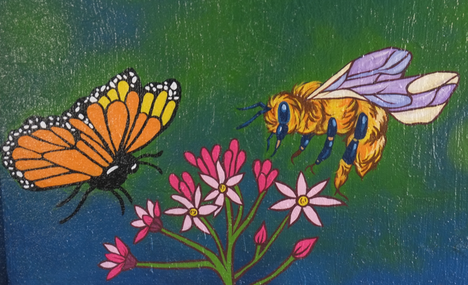 street art mural on wall of railway underpass on Bloor street West, a butterfly and a bee by some small pink flowers