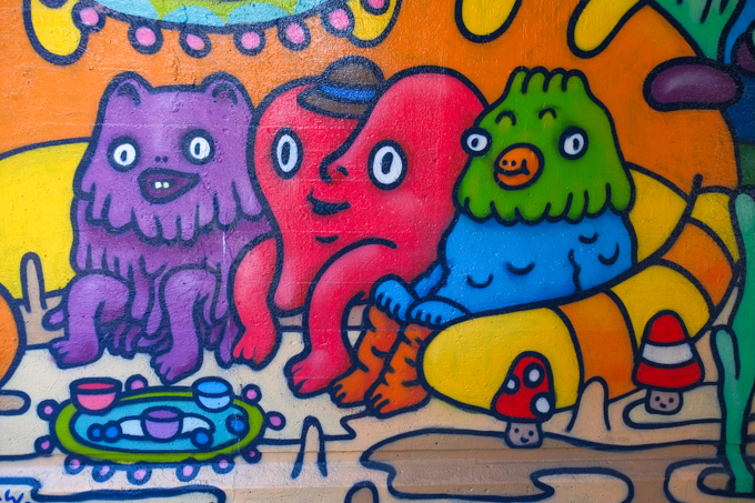 street art mural on wall of railway underpass on Bloor street West cartoon llike characters by StephVonAwesome aka Stephanie Avery<