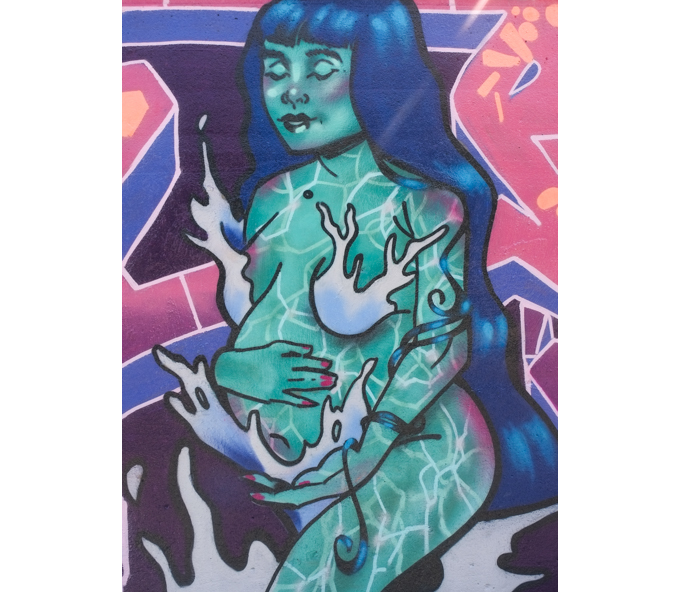 street art mural on wall of railway underpass on Bloor street West, water is life, pregnant woman