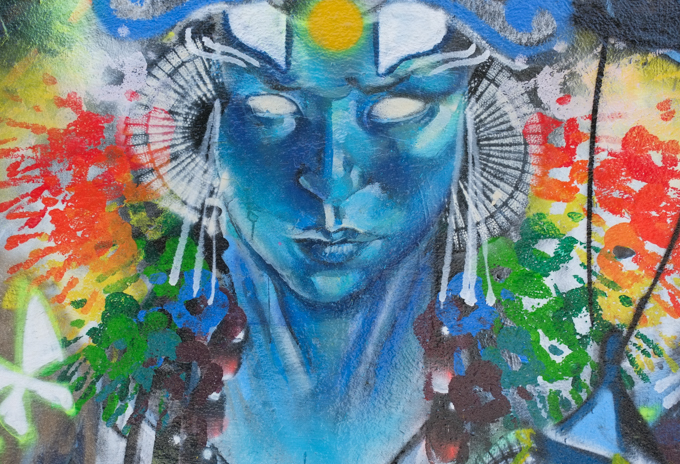 street art mural on wall of railway underpass on Bloor street West by Rowell Soller