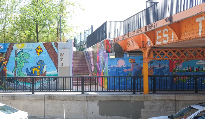street art mural on wall of railway underpass on Bloor street West where it joins Wallace street entrance to the Toronto Railpath 