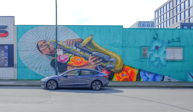 part of a mural, Dance the Dance My Girl by Ari de la Mora and Irving Cato in Vancouver, woman playing a saxophone