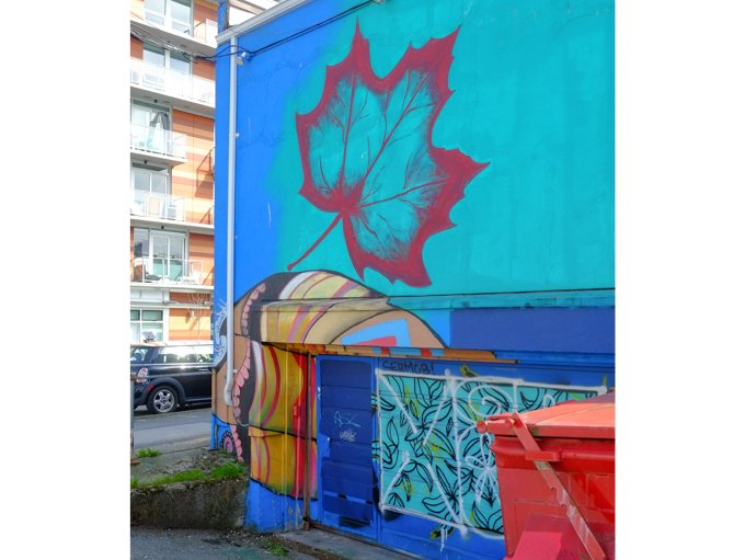 part of a mural, Dance the Dance My Girl by Ari de la Mora and Irving Cato in Vancouver, maple leaf