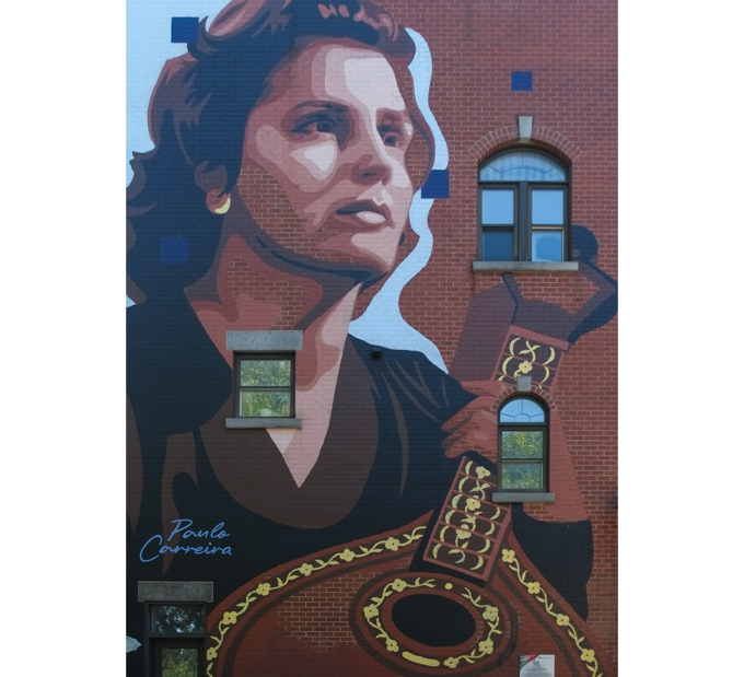 large mural, a portrait of Amalia Rodrigues, the Queen of Fado which is Portuguese music.  Painted by Paulo Carreira
