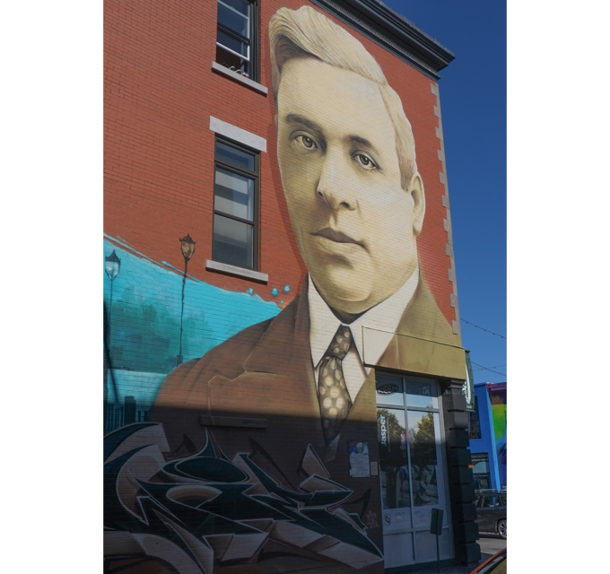 mural, Ange de Bordeaux by Awie, covers the side of a building, portrait of a middle age man