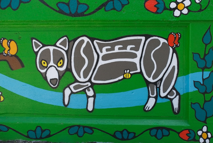 street art mural on wall of railway underpass on Bloor street West, by Waskwane Designs, animal, wolf in black and white