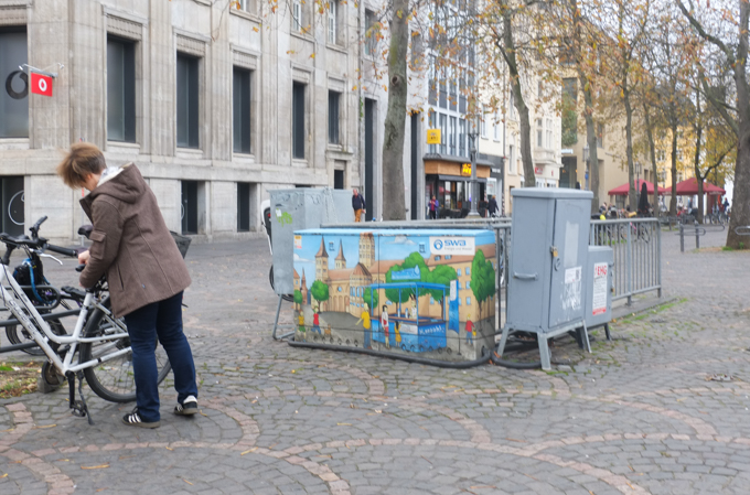 sidewalk utility box in Bonn Germany,painted with a city scene,