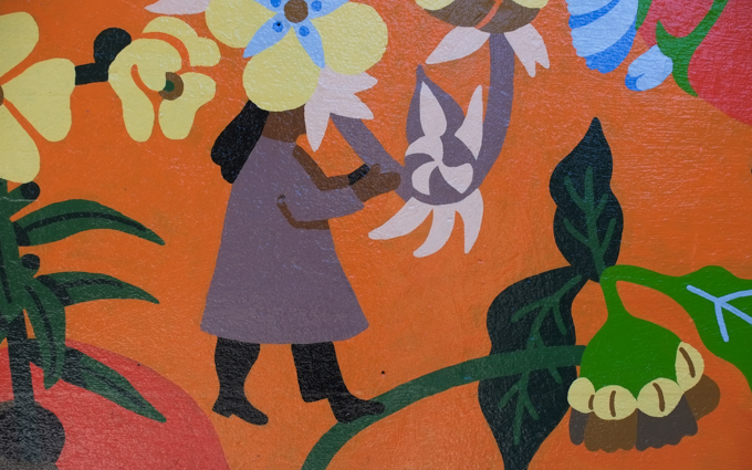 street art mural on wall of railway underpass on Bloor street West, a mural of people and flowers created by Caitlin Taguibao and Andrea Manica