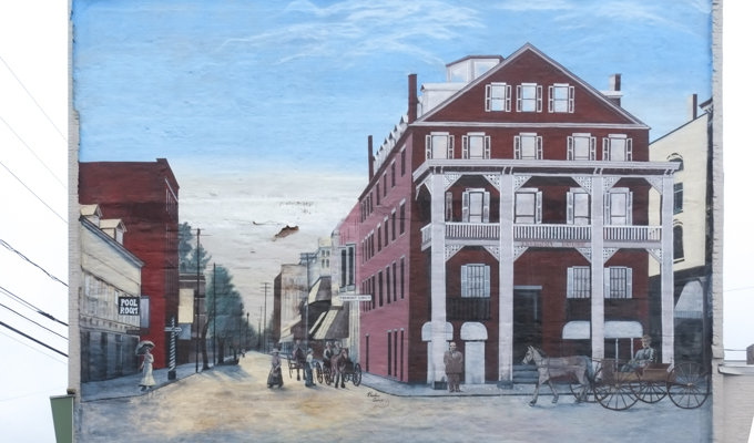 mural, a view of West Pearl Street, Nashua NH in 1909 with Tremont House which was a hotel, in the foreground