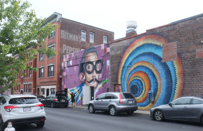 HoxxoH mural in Salem, circles like a spiral vortex in yellow, orange, and blue