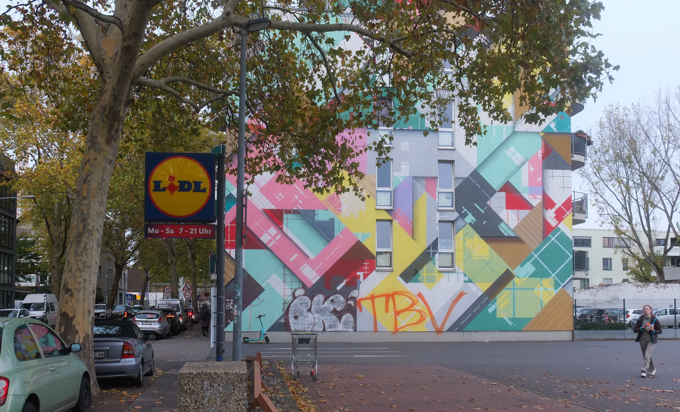urban art, street art, in Cologne Germany, near Ehrenfeld station, geometric abstract by zedz on side of residential building