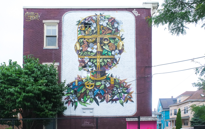 Garden Boy by Pixel Pancho, large mural, head and shoulders of boy entirely in flowers and leaves