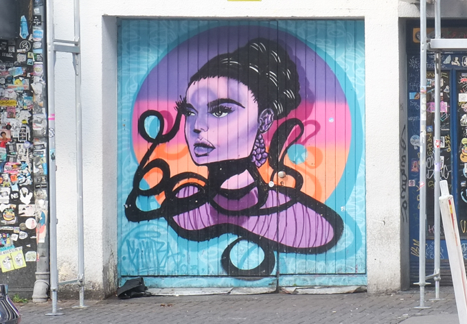 mural, woman's portrait by Simba