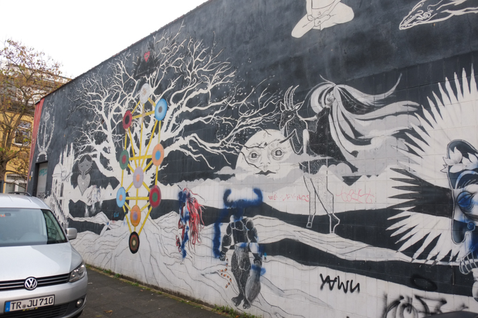urban art, street art, in Cologne Germany, near Ehrenfeld station, mystical wall mural by Captain Borderline and Rakaposhii,
