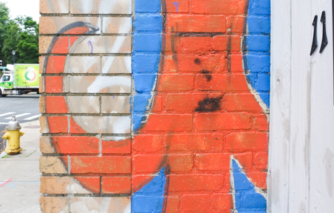little orange characters with curly arms, on a blue background