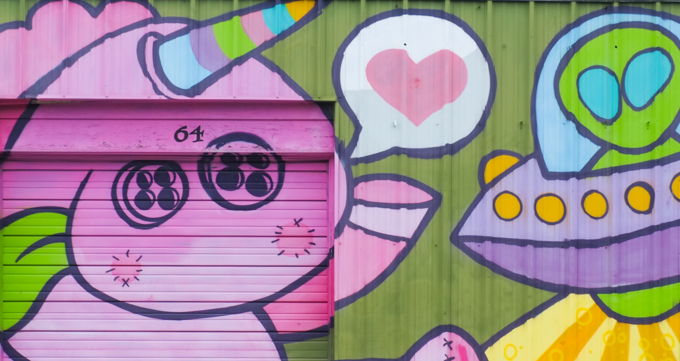 part of a Golden 305 mural in Salem, pink unicorn with rainbow cooured horn, with pink heart, button eyes