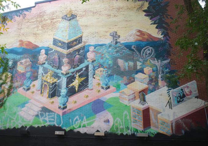 mural in soft colours, temple in an urban setting