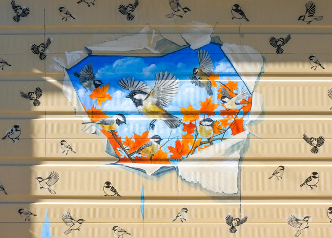 street art mural on garage door in Miriam Garfinkle Lane, by Murals by Marg, chickadees