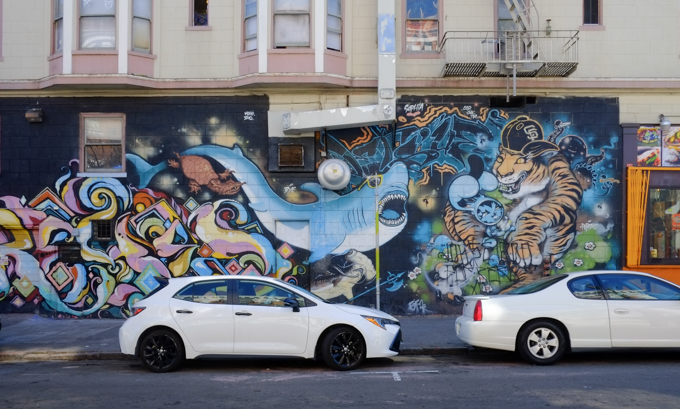 In Mission District of San Fran, on 15th street, a mural by Persue, Dave Persue Ross, sharks vs tiger